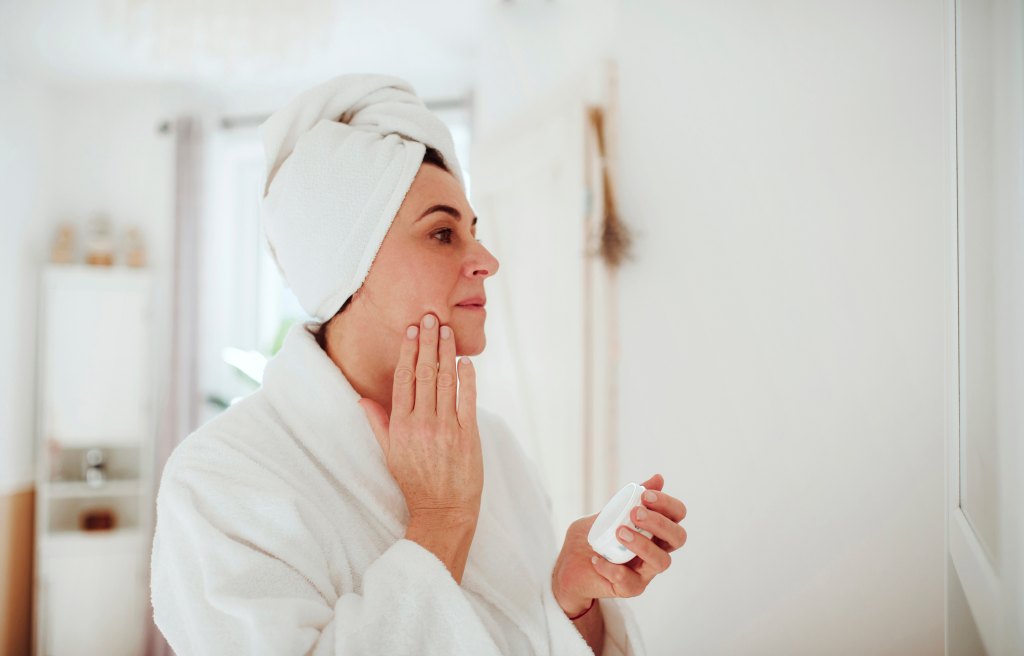 mature woman doing skin care
