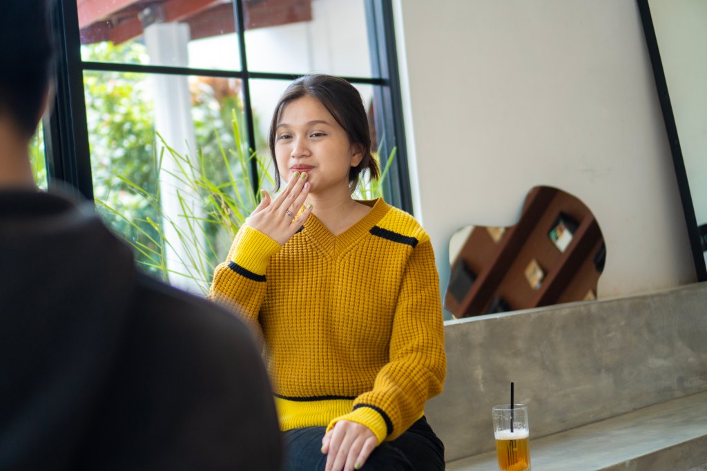 A woman using sign language to communicate
