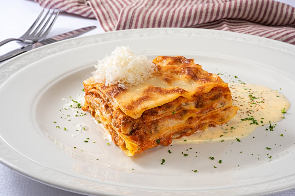 Alex Guarnaschelli's grandma's classic lasagna slice on plate