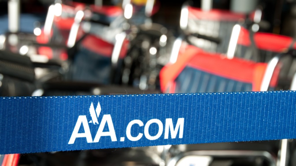 An American Airlines barrier belt and wheelchairs