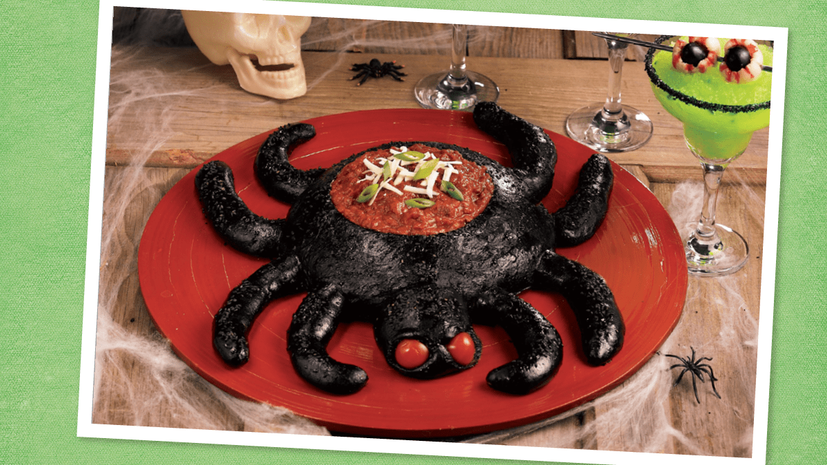 Spider Bread Bowl with Hot Chili Dip sits looking spooky (Halloween dinner ideas)