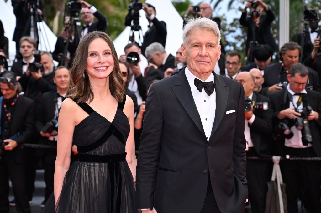 Calista Flockhart and Harrison Ford attend the "Indiana Jones And The Dial Of Destiny" red carpet during the 76th annual Cannes film festival at Palais des Festivals on May 18, 2023 in Cannes, France.