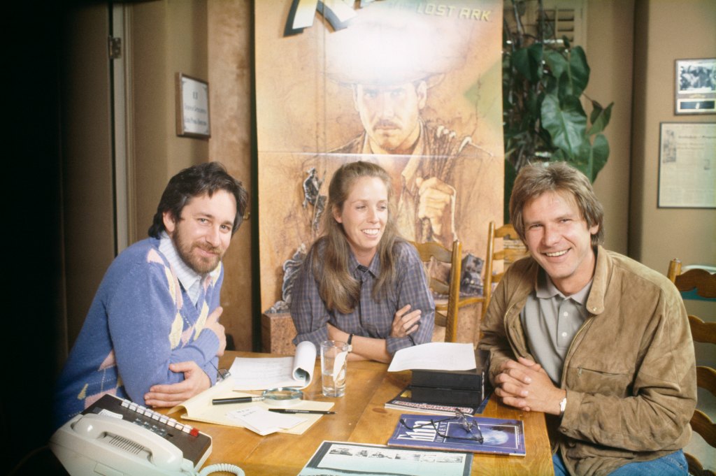 Original caption: American director, screenwriter and producer Steven Spielberg at home in Los Angeles with actor Harrison Ford and his wife, screenwriter and producer Melissa Mathison.