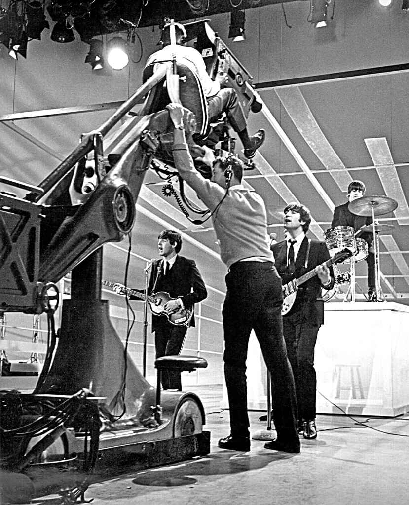 NEW YORK - FEBRUARY 9: Bassist Paul McCartney, guitarist John Lennon and Drummer Ringo Starr of the rock and roll band "The Beatles" prepare for their performance on "The Ed Sullivan Show" on February 9, 1964 in New York City, New York.