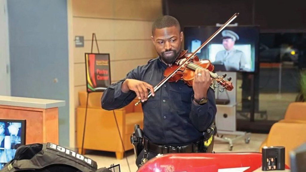 Officer Alexander Strachan plays violin