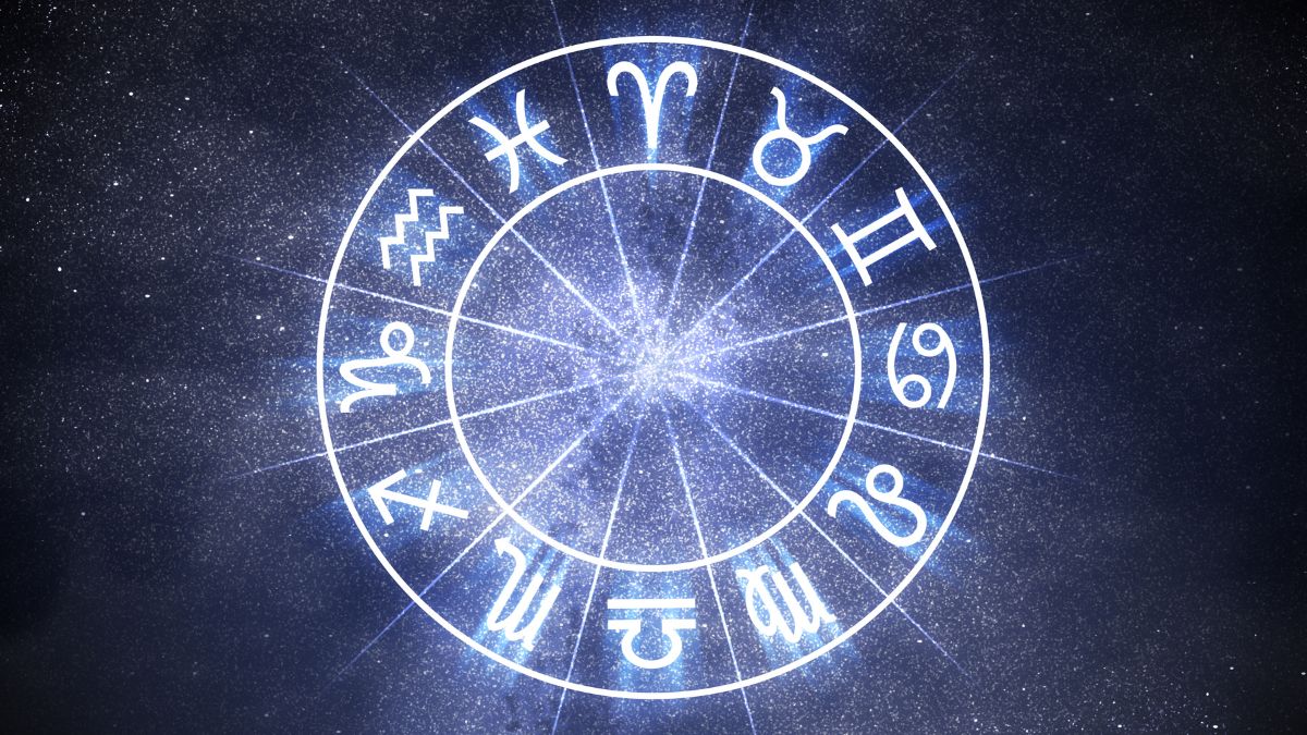 Astrology and horoscopes concept. Astrological zodiac signs in circle on starry background.