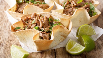 Dutch oven-braised pork carnitas served out of a tortilla shell