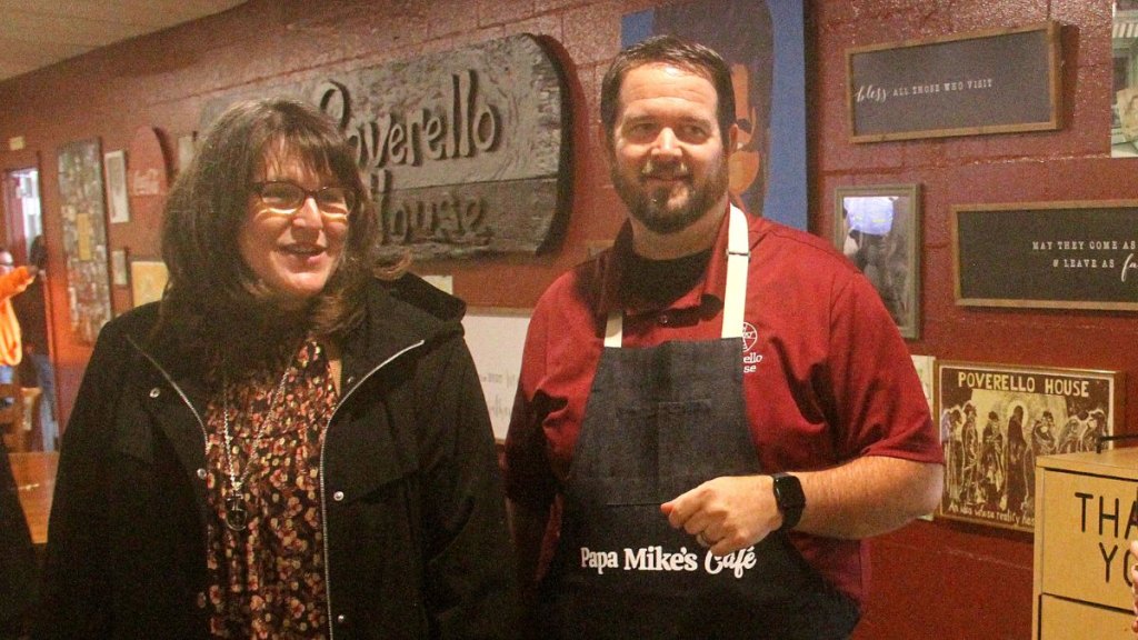 Zack Darrah (right), founder and executive director of Papa Mike’s Café, greets diners and stops by tables to chat. Along with rave reviews for the meals he serves, people thank him for making them feel loved.