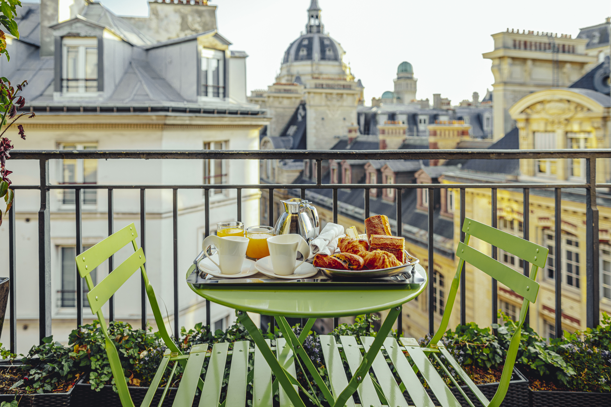 table with French food on balcony overlooking Paris skyline