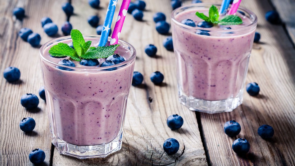 Dr. Axe’s Easy Coconut-Collagen Smoothie made with blueberries and coconut oil for weight loss