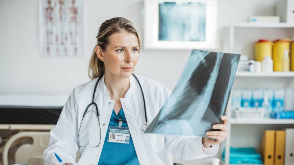 Doctor holding up an x-ray