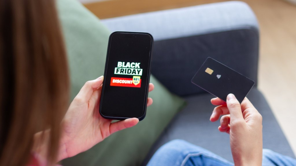 A woman Black Friday shopping on her phone