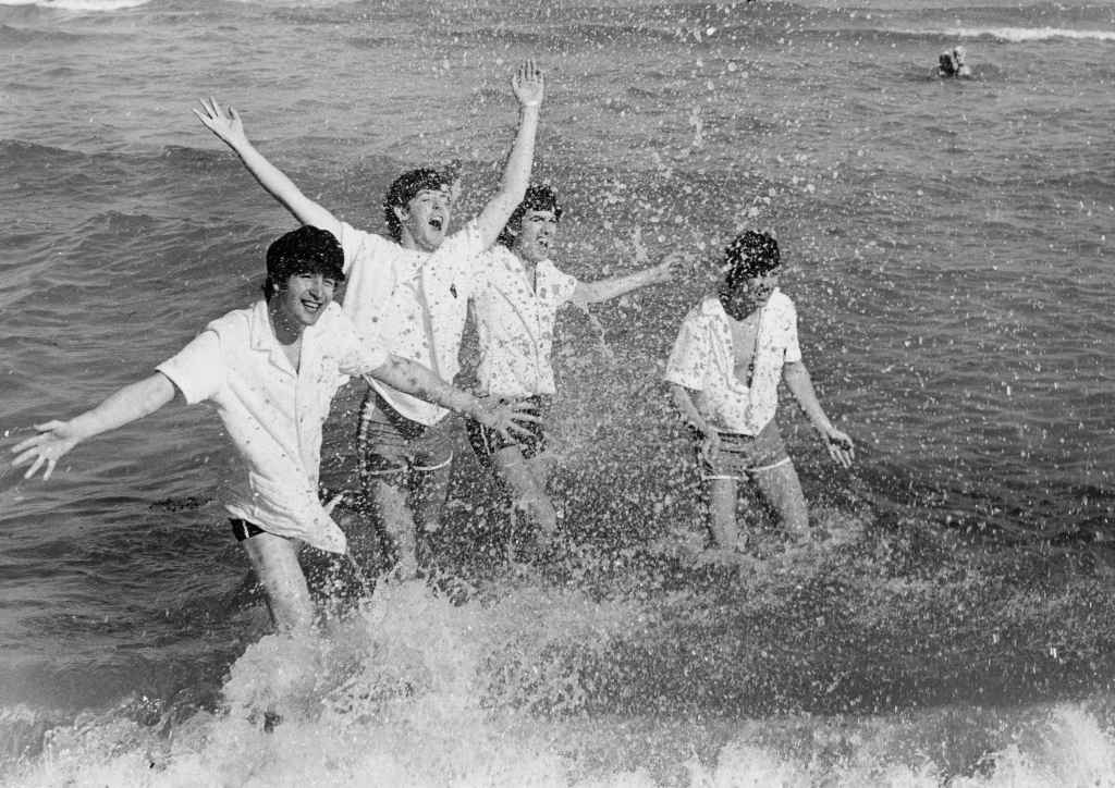 English pop group The Beatles frolicking in the surf at Miami Beach, Florida, February 1964. 