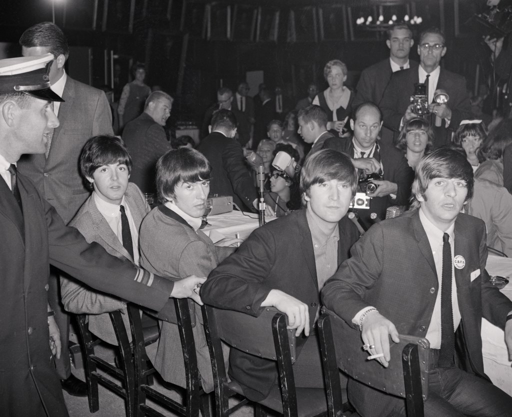 (Original Caption) Yeah! Yeah! Yeah! They're Here! Chicago: (Top left to right) Ringo Starr, Paul McCartney, (Bottom left to right) John Lennon, and George Harrison, The Beatles have arrived in Chicago for their appearance in the International Amphitheater here. The Beatles are shown at a press conference just before their appearance.