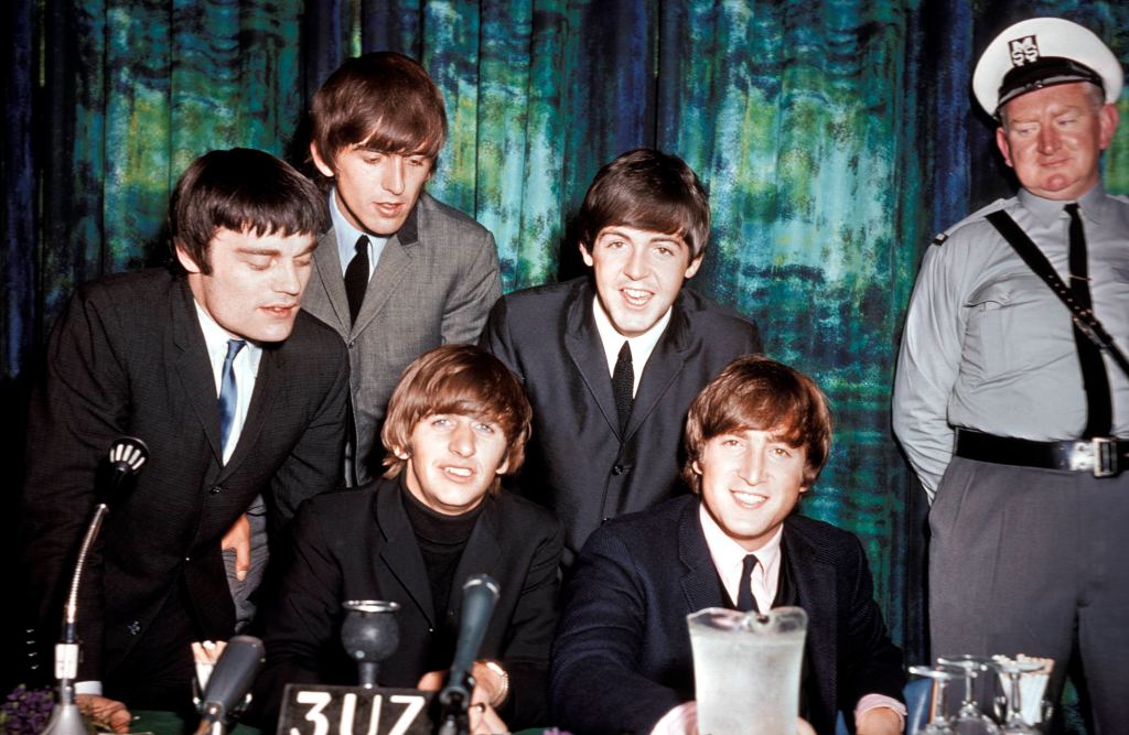 BEATLES; with Jimmy Nicol (Ringo's temporary stand in whilst he was having his tonsils removed).- L-R: Jimmy Nicol, George Harrison, Ringo Starr, Paul McCartney, John Lennon - posed, group shot at press conference