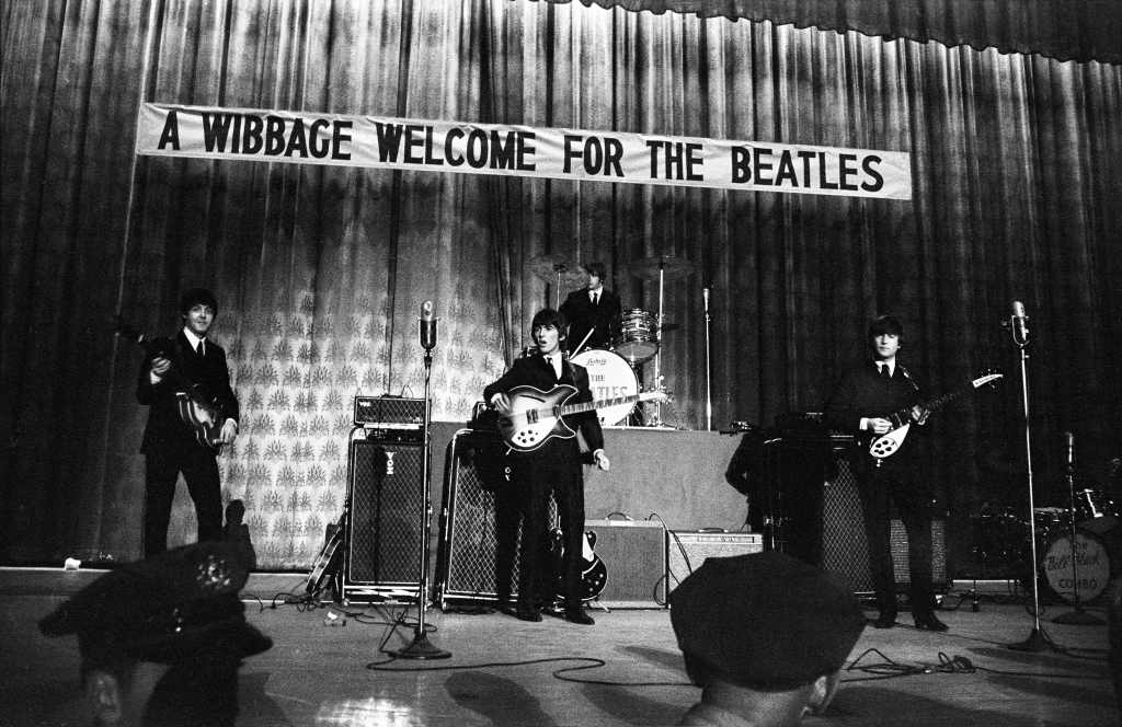 The Beatles perform onstage at Convention Hall during their first US tour, Philadelphia, Pennsylvania, September 2, 1964.