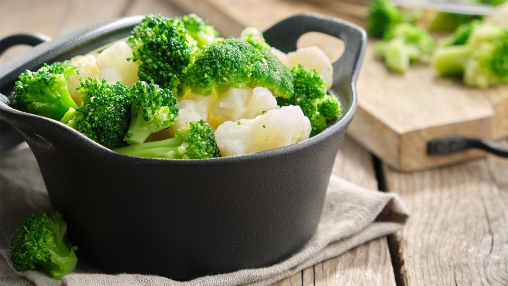 Lemon-infused broccoli and cauliflower as a side dish for puff pastry chicken pot pie