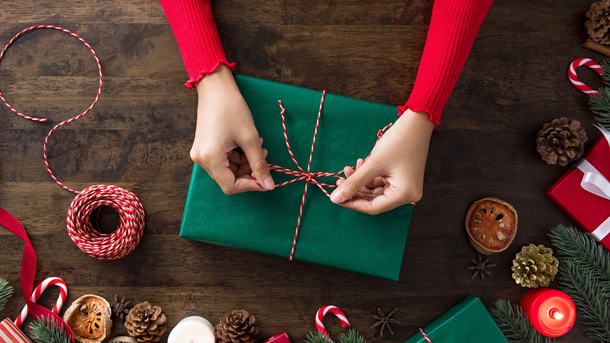 A woman wrapping a gift