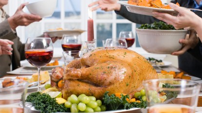 What to take to thanksgiving dinner table with a turkey and food