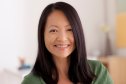 Woman smiling with flawless skin after using silicone patches