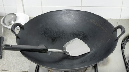 wok with spatula after learning how to clean a wok
