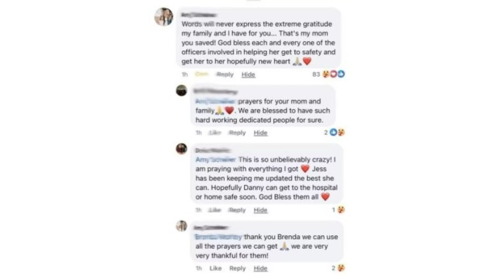 A woman thanks the New York State Police troopers.