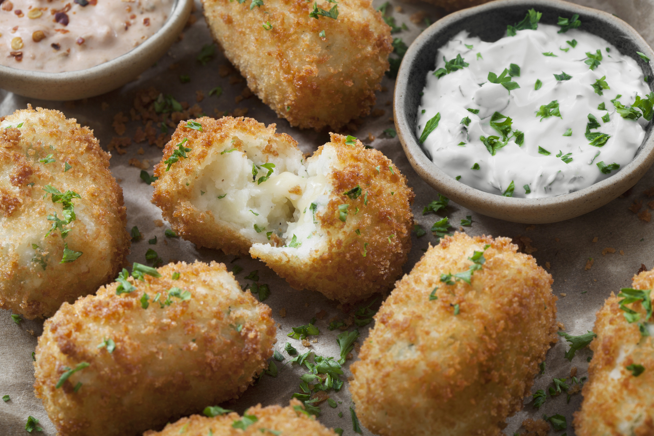 Air fryer potato balls with a creamy dipping sauce