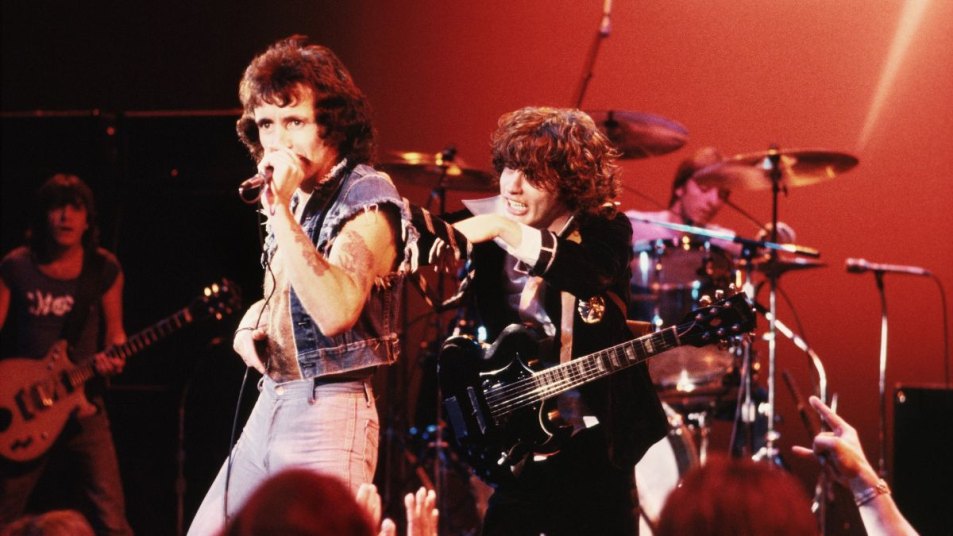 Angus and Malcolm Young: The Bond That Built AC/DC’s Legacy | Woman's World
