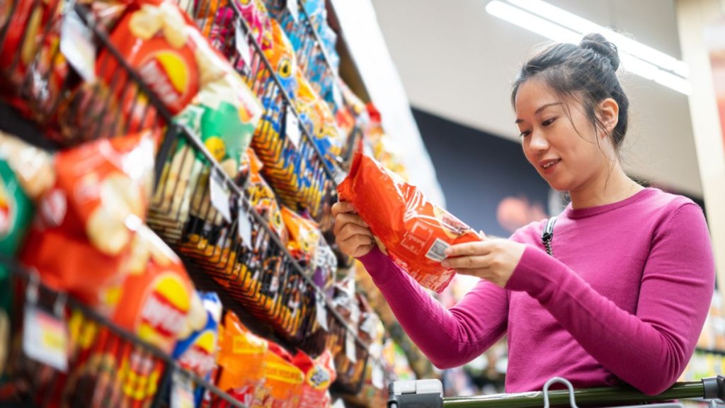 asian female shopping in supermarket
