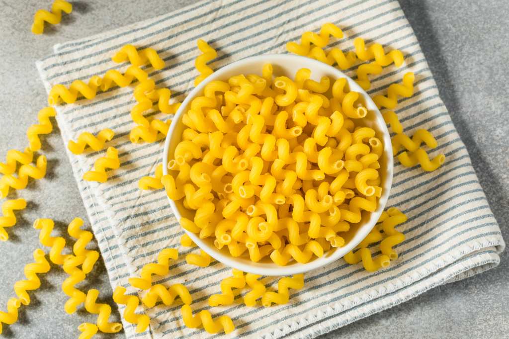 dry yellow Italian Cavatappi pasta in a bowl