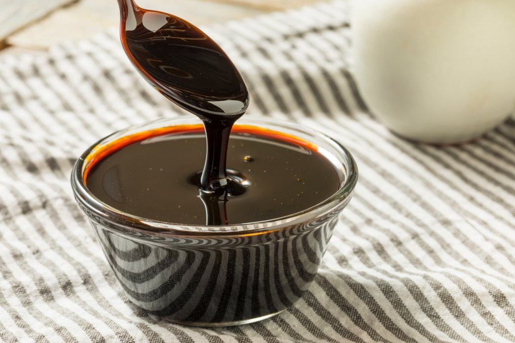 bowl of molasses with spoon