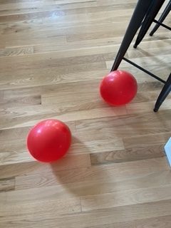 Red balloons that Carol surprisingly found—She knows they are a sign from Kyle!