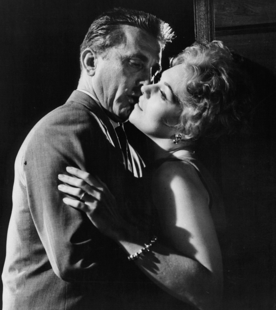 Kirk Douglas and Kim Novak embrace in a scene from the film 'Strangers When We Meet', 1960