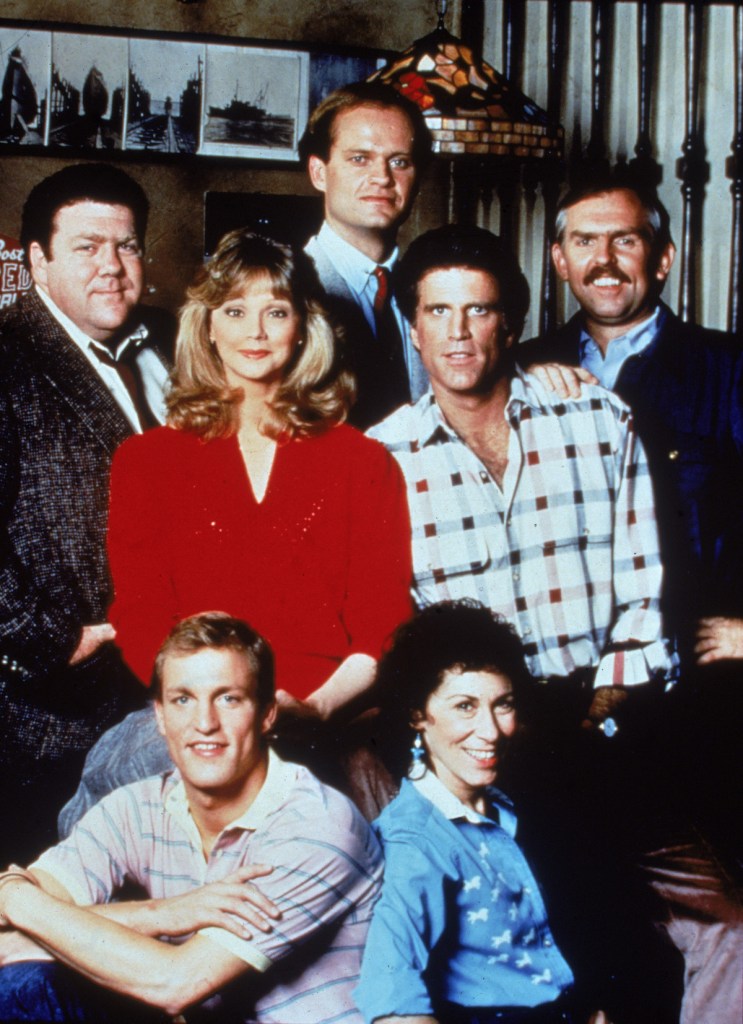 Portrait of the cast of the TV series, 'Cheers,' circa 1985. CW, L-R: George Wendt, Shelley Long, Kelsey Grammer, Ted Danson and John Ratzenberger. Front- Woody Harrelson and Rhea Perlman Funniest Sitcom Episodes