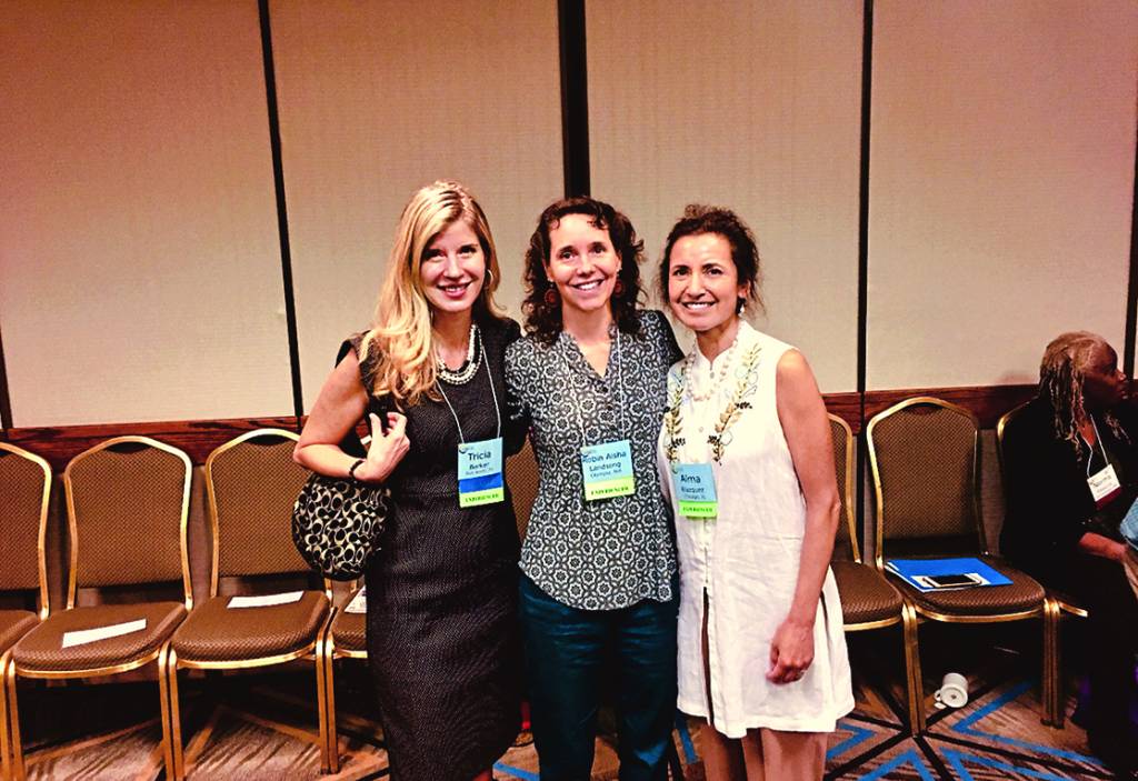 Tricia (left) at a conference in 2018 where she shared her story with other people who’ve had NDEs