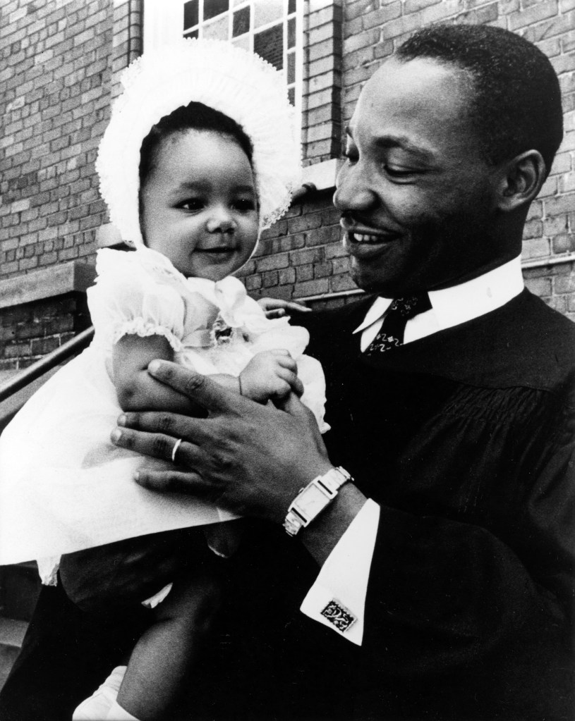 American Civil Rights and religious leader Dr Martin Luther King Jr (1929 - 1968) holds his infant daughter, Yolanda King (1955 - 2007), in his arms, 1956