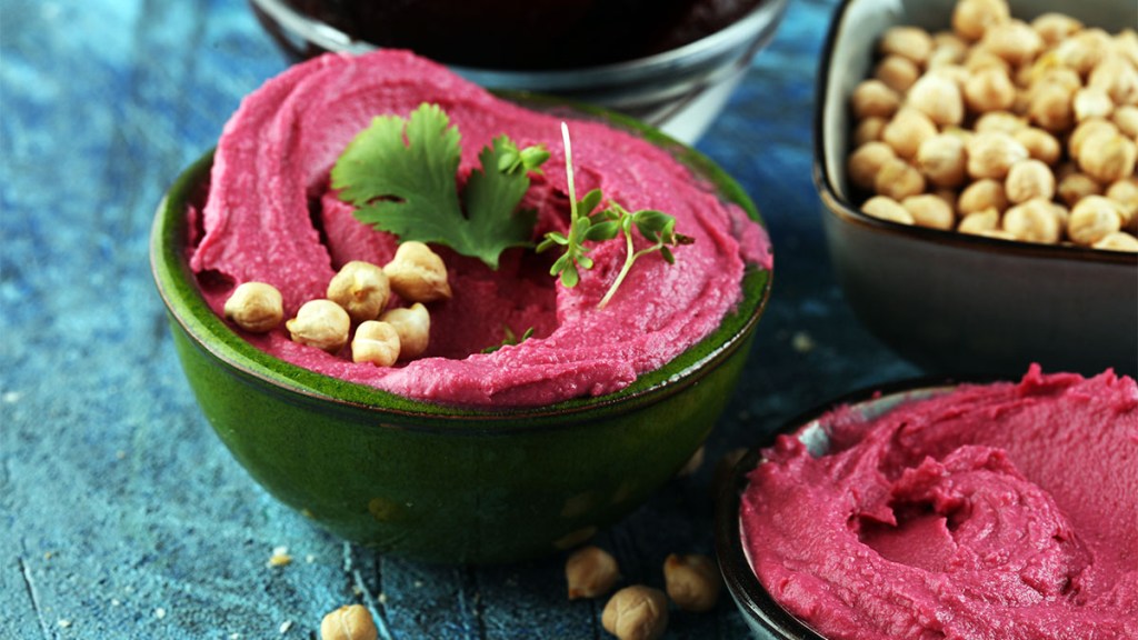Bowl of beetroot hummus made with chickpeas