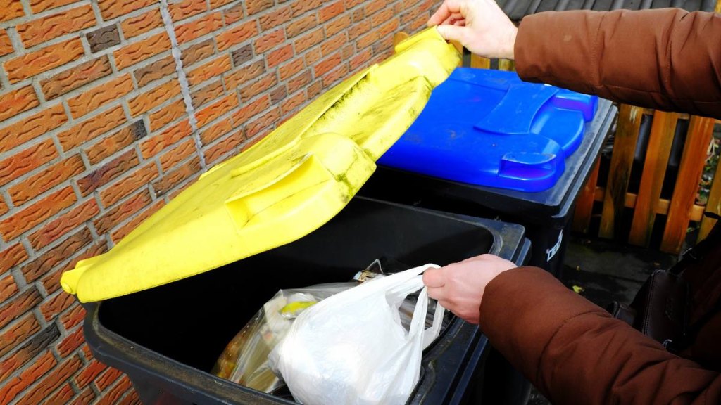 Person throwing away trash