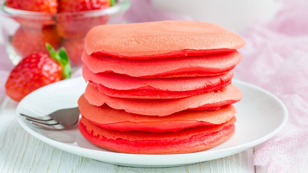 Stack of pink pancakes on a plate, recipe for the Planstrong diet