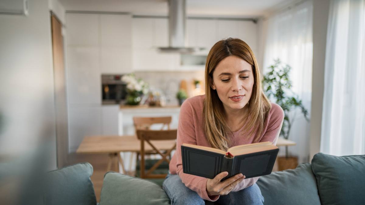 Woman captivated by her book