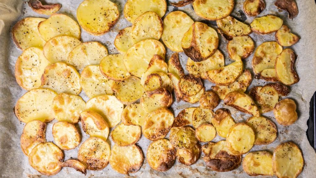 Sliced baked potatoes on tray
