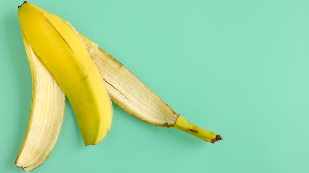 A banana peal on an aqua background