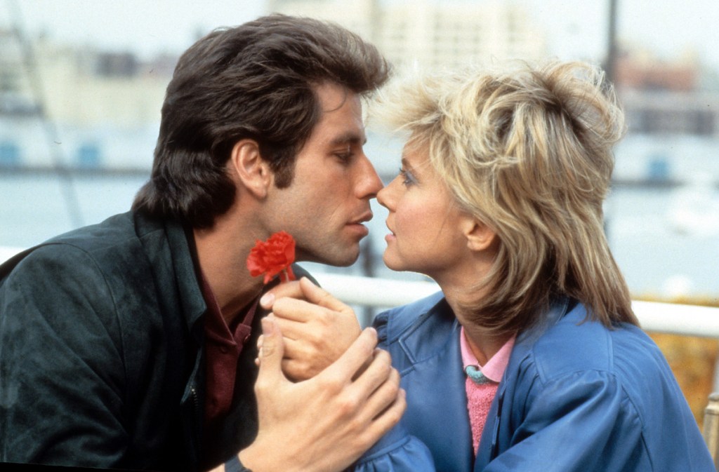 John Travolta kisses Olivia Newton-John in a scene from the film 'Two Of A Kind', 1983