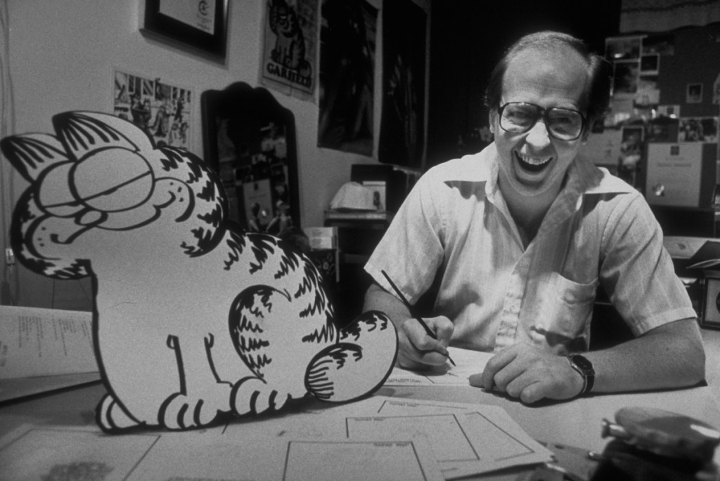 Jim Davis with one of his Garfield drawings in 1998