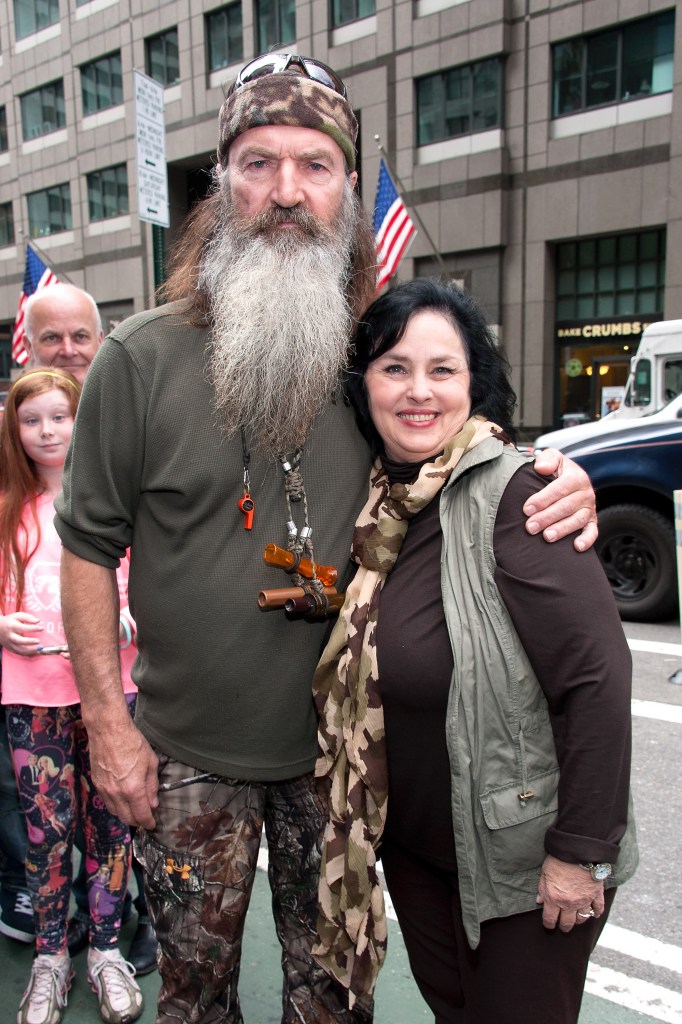Phil and Kay Robertson visit "Extra" in NYC with his famous duck calls around his neck