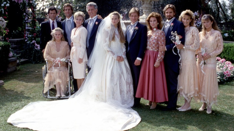 (L-R) American actor and singer, A Martinez (Cruz Castillo), American youth minister and actress, Marcy Walker (Eden Capwell), American actor, Todd McKee (Ted Capwell), American actress, Judith McConnell (Sophia Wayne Capwell), American actor and television host, Jed Allan (1935-2019) (C.C. Capwell), American actress and director Robin Wright (Kelly Capwell Perkins), South African actor, Ross Kettle (Jeffrey Conrad), American actress, Marj Dusay (1936-2020) (Pamela Pepperidge Capwell Conrad), American actor Lane Davies (Mason Capwell), American actress, Kristen Meadows (Victoria Lane) and American actress Nancy Lee Grahn (Julia Wainwright Capwell), of the American television soap opera "Santa Barbara", pose for a family picture, circa 1987 in Los Angeles, California