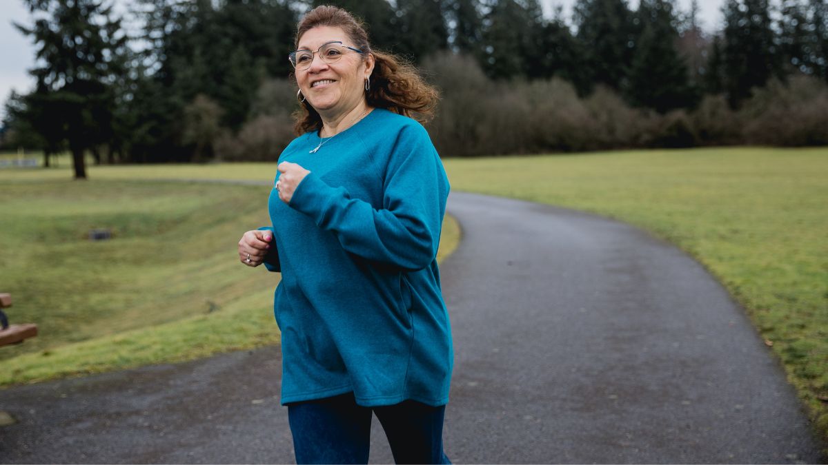 woman smiling on a walk outdoors
