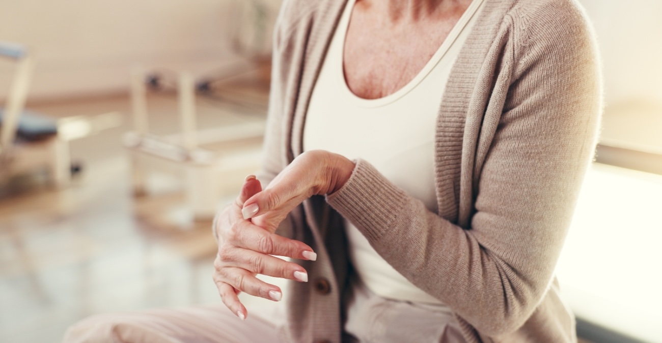 Close-up of a woman stretching her hands to treat carpal tunnel