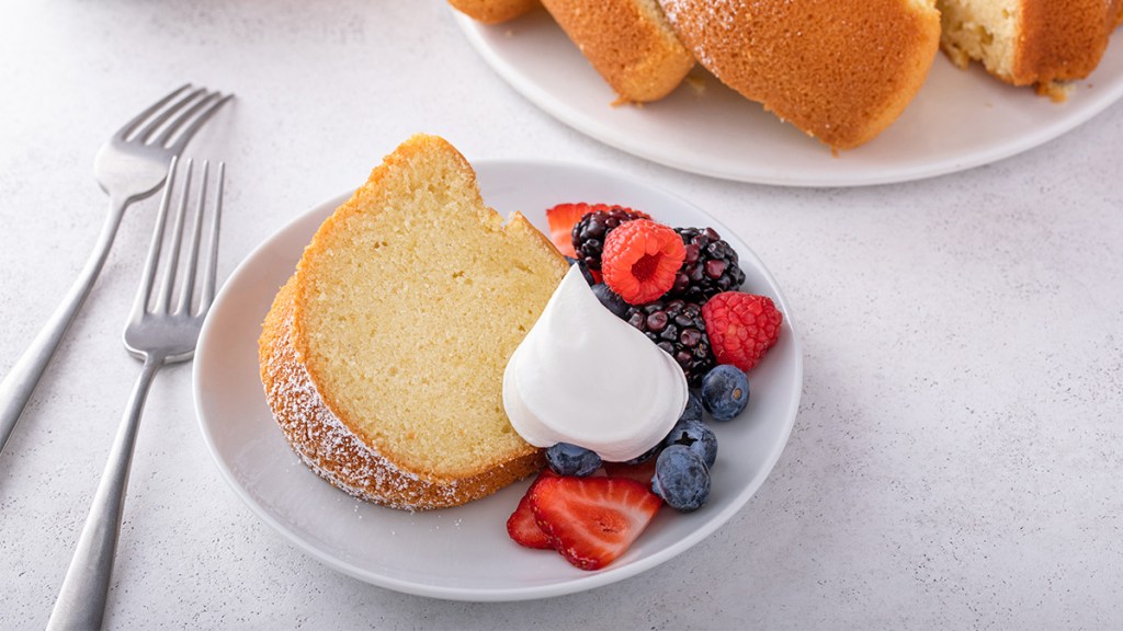 A slice of cold oven pound cake with yogurt and berries