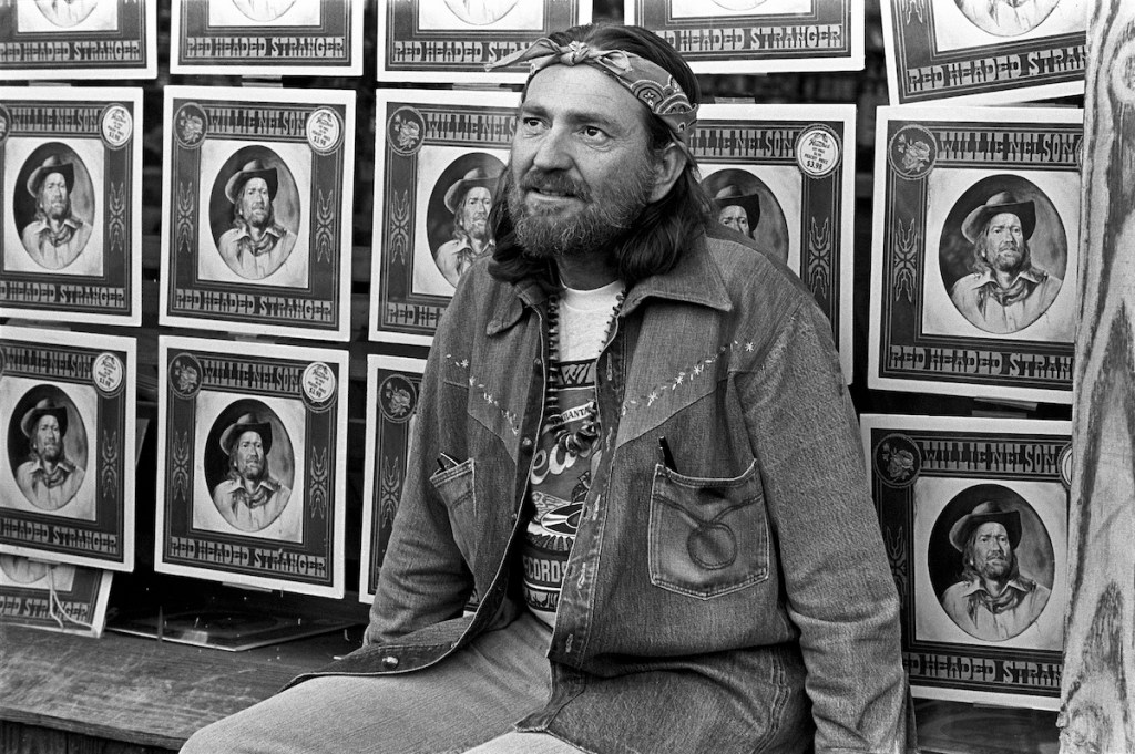 Country music singer-songwriter Willie Nelson promotes his "Red Headed Stranger" album at Peaches Records and leaves his footprints in concrete on October 28, 1975 in Atlanta, Georgia